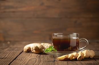 hot ginger juice ginger sliced wooden table